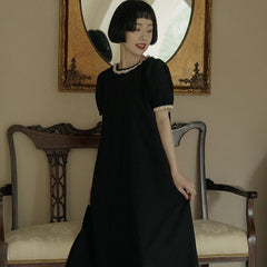 Back bow hollowed-out short-sleeved lantern-sleeved little black dress - MEIMMEIM(メイムメイム)